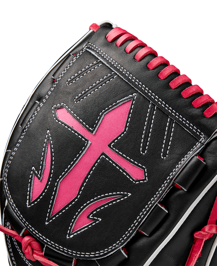 Close-up of the Wilson A2K B23 12" Baseball Glove (FALL 2024), featuring Pro Stock leather in black with white stitching, a bold pink-edged cross design, and pink lacing along the top.
