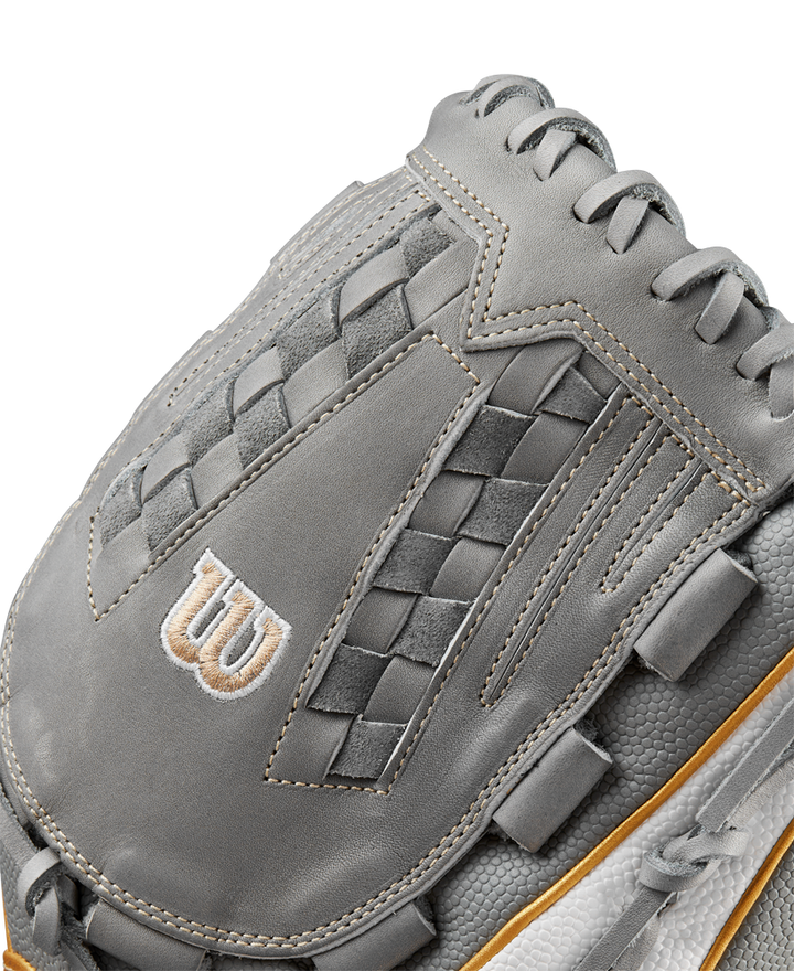 Close-up of a Wilson A2000 V125SS 12.5" Fastpitch Glove (WBW102677125) in gray, showing intricate stitching, woven detailing, a white W logo, varied textures, and brown edge trim.