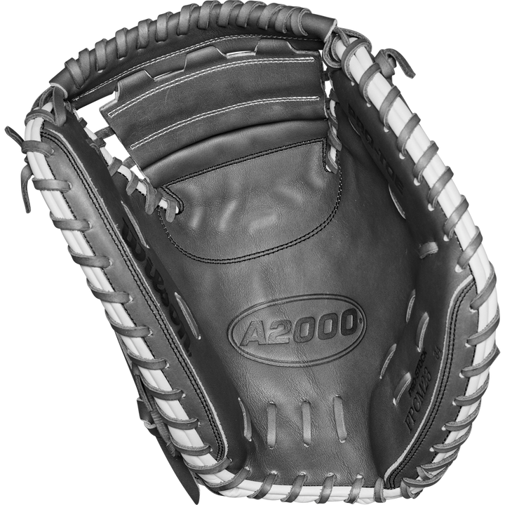 A close-up of the Wilson A2000 FPCM23 34" Fastpitch Catcher's Mitt (WBW10268134) in black and white Pro Stock Leather, featuring detailed stitching, lacing, and embossed branding.