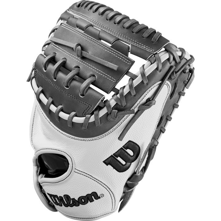 The Wilson A2000 FPCM23 34" Fastpitch Catcher's Mitt (WBW10268134) features a white and gray design with black stitching, the Wilson logo on the thumb, and is crafted from durable Pro Stock Leather. Shown against a plain white background.