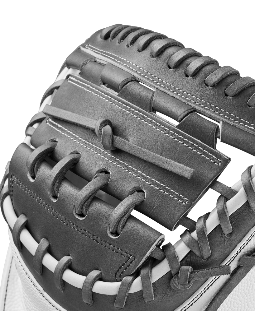 Close-up of the Wilson A2000 FPCM23 34" Fastpitch Catcher's Mitt (WBW10268134), highlighting its black and white Pro Stock Leather, detailed stitching, webbing, and laces.