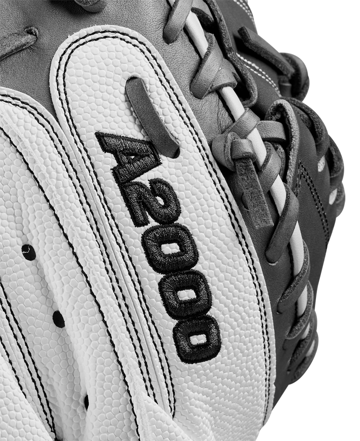 A close-up of the Wilson A2000 FPCM23 34" Fastpitch Catcher's Mitt (WBW10268134), crafted with Pro Stock Leather, highlights the exceptional quality and durability expected from a Wilson glove.