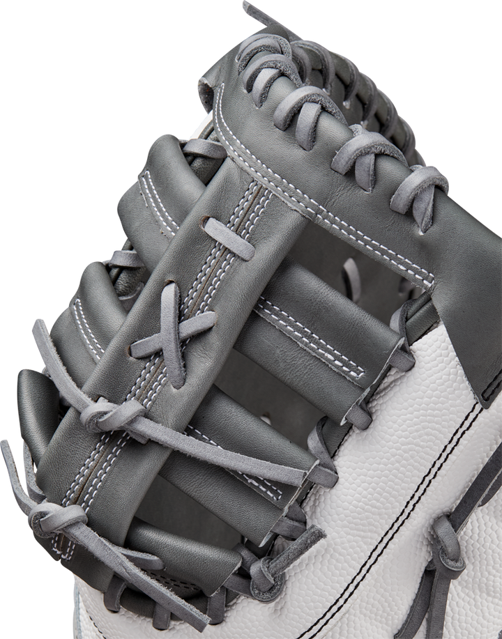 A close-up of the Wilson A2000 1620SS 12.5" Fastpitch First Base Mitt (WBW102682125), featuring gray and white Pro Stock leather, highlights detailed stitching and lacing on the webbing and thumb area.