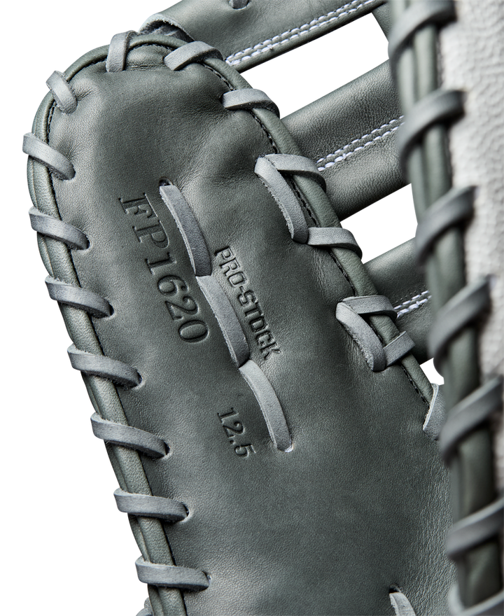 Close-up of a Wilson A2000 1620SS 12.5" Fastpitch First Base Mitt (WBW102682125) in gray, displaying embossed Pro Stock leather with visible stitching and lacing details.
