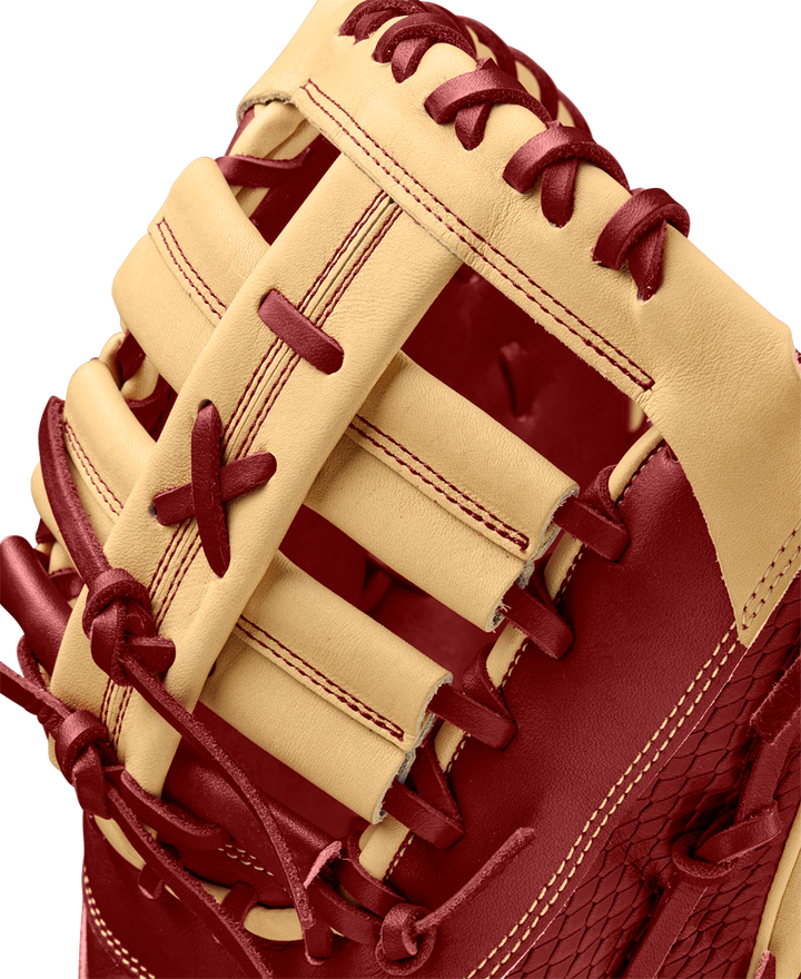 A close-up of the Wilson A2K 1679 12.5" First Base Mitt (WBW102684125), crafted with Pro Stock Select leather and featuring a Single Post Web.