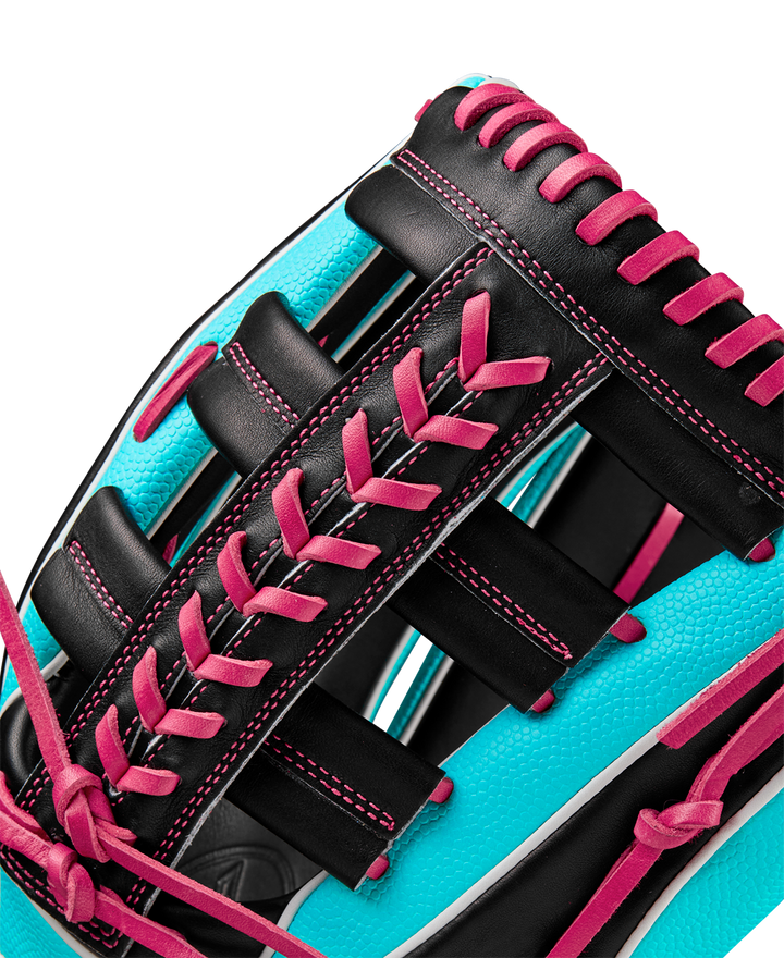Close-up of the Wilson A2K 1810SS 12.75" Baseball Glove (Winter 2024: WBW1026881275) showing bright turquoise Pro Stock Select leather, black panels, and vivid pink laces accentuating the glove’s texture and stitching.