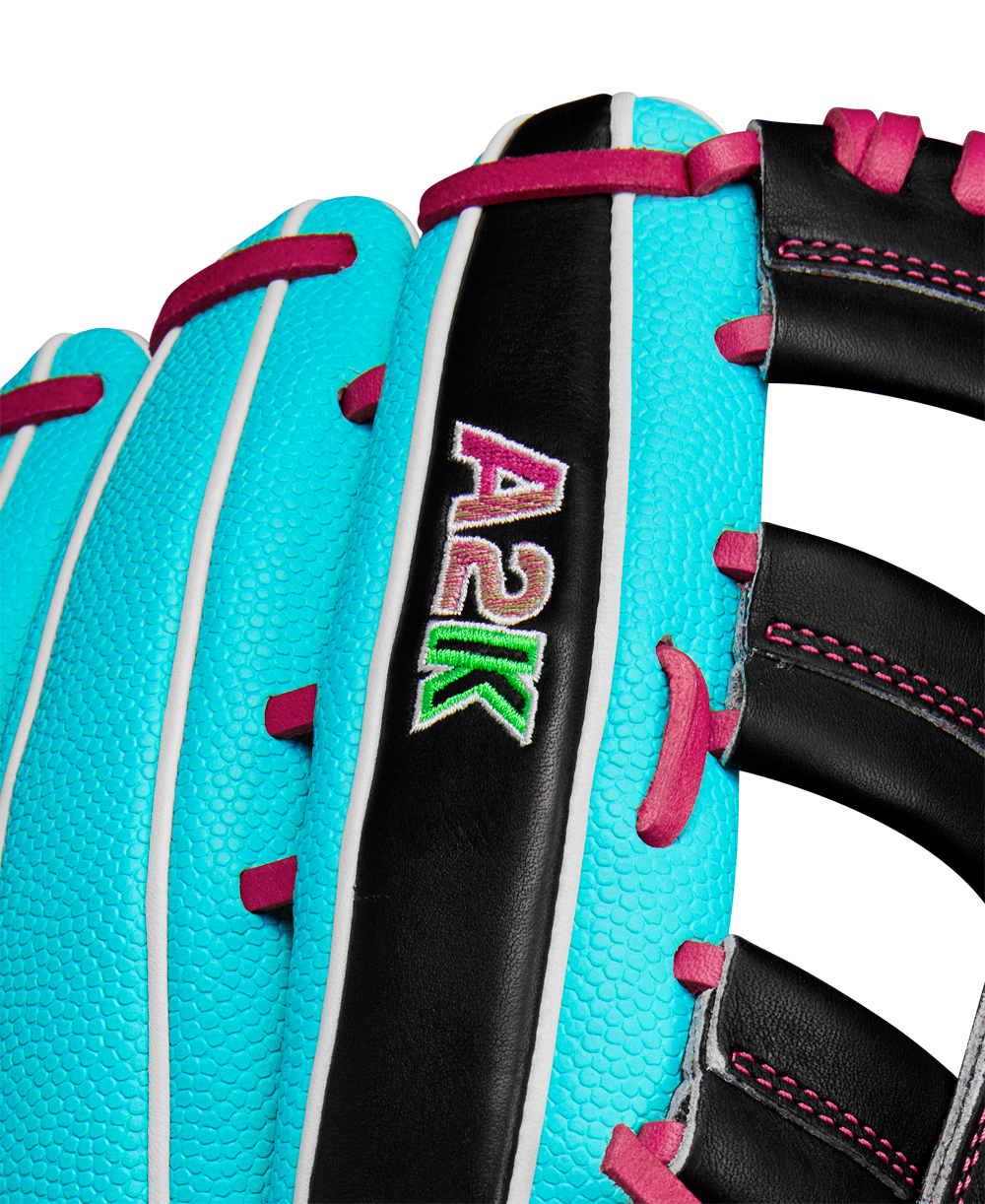 Close-up of the Wilson A2K 1810SS 12.75" Baseball Glove (Winter 2024) featuring turquoise Pro Stock Select leather, white piping, black accents, and pink stitching with an eye-catching pink, white, and green embroidered A2K logo.