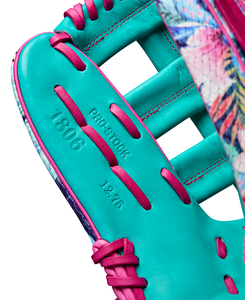 Close-up of the Wilson A2000 RA56 12.75" Randy Arozarena GM Baseball Glove, WBW1026941275, featuring turquoise and pink leather with floral accents—just like the pro's glove for Spring 2025.