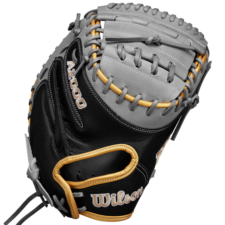 The Wilson A2000 FPCM23 34" Fastpitch Catcher's Mitt (SPRING 2025: WBW10274434) features a black, gray, and tan design with visible lacing and stitching, crafted from Pro Stock leather, shown on a plain white background.