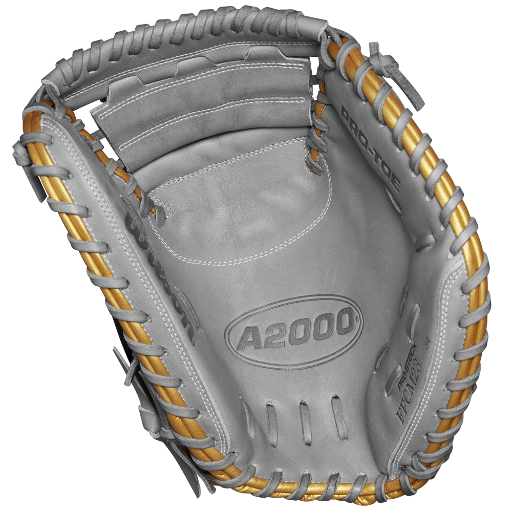 The Wilson A2000 FPCM23 34" Fastpitch Catcher's Mitt, SPRING 2025 (WBW10274434), features gray Pro Stock leather with tan laces and PRO-TOP embossed on the palm, shown against a white background.
