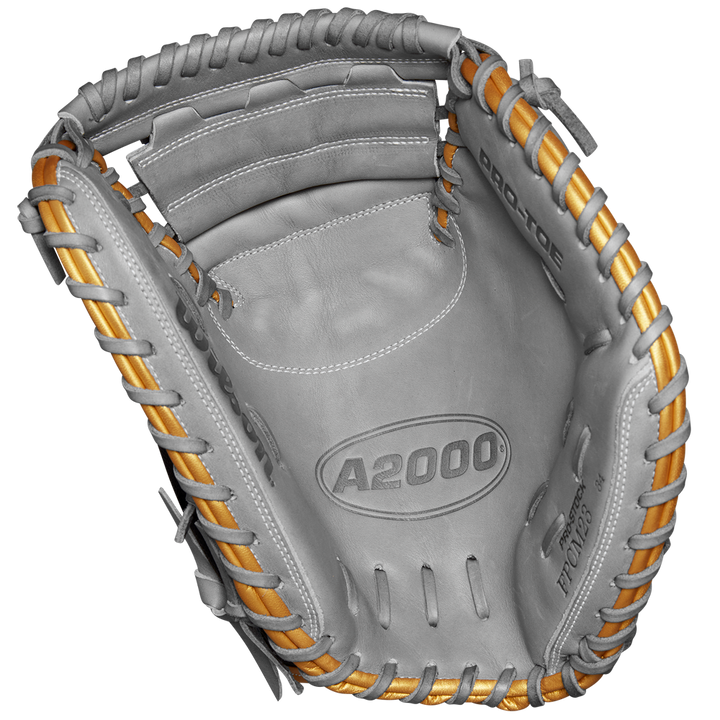 The Wilson A2000 FPCM23 34" Fastpitch Catcher's Mitt, SPRING 2025 (WBW10274434), features gray Pro Stock leather with tan laces and PRO-TOP embossed on the palm, shown against a white background.