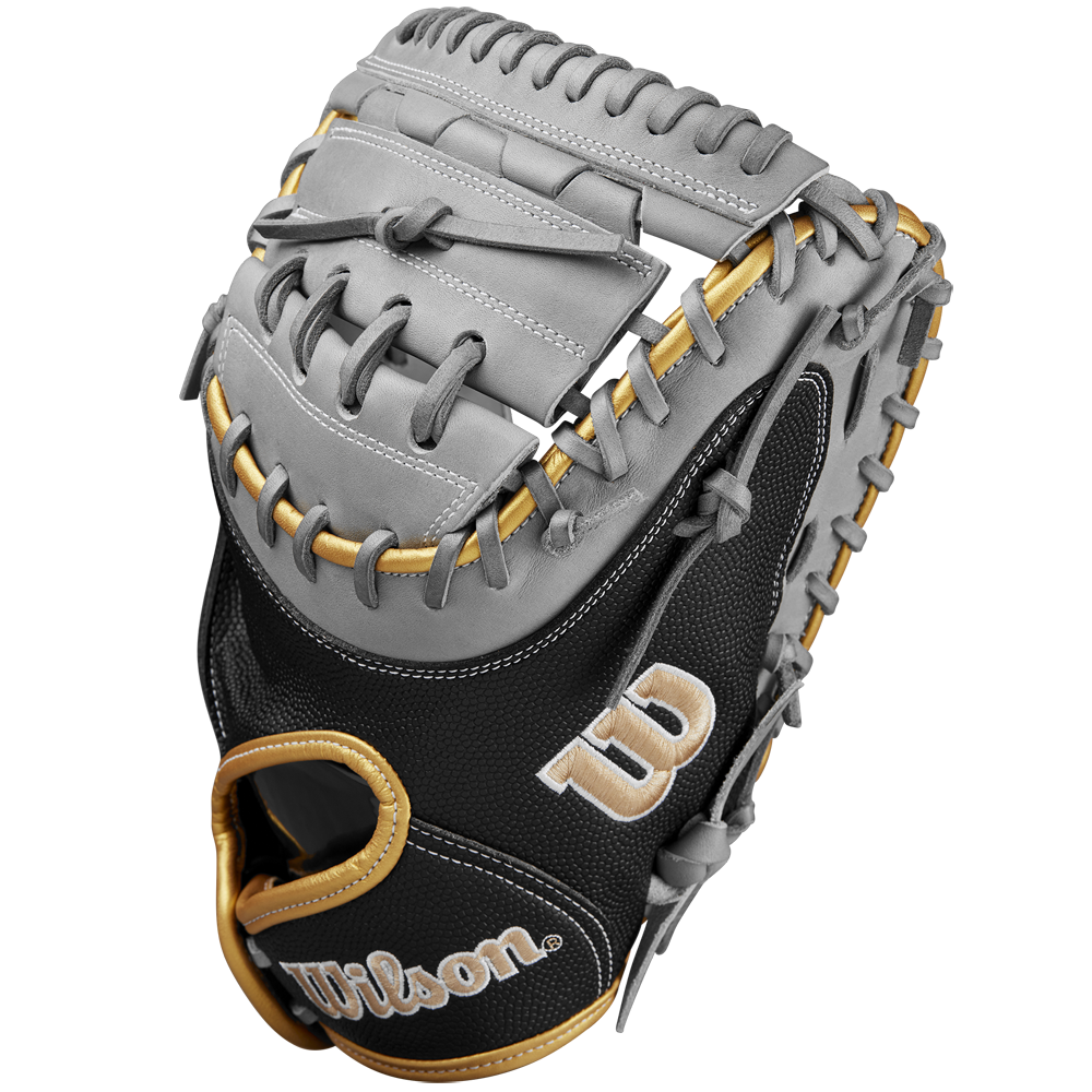 A close-up of the Wilson A2000 FPCM23 34" Fastpitch Catcher's Mitt with gray Pro Stock leather, tan laces, black SuperSkin accents, and gold and white embroidered W and Wilson logos. Brand: Wilson. Model: WBW10274434.