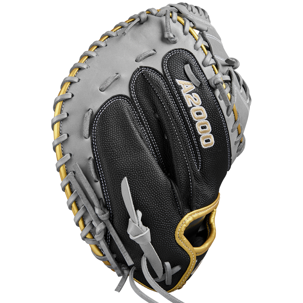 The Wilson A2000 FPCM23 34" Fastpitch Catcher's Mitt (SPRING 2025: WBW10274434) by Wilson is shown in black/gray Pro Stock leather with tan laces, visible stitching, and branding from the back.