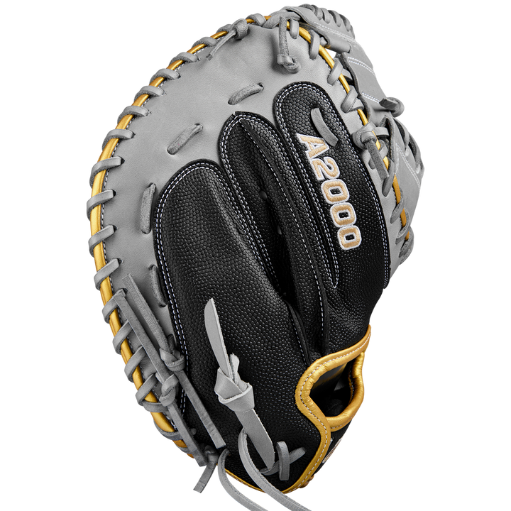 The Wilson A2000 FPCM23 34" Fastpitch Catcher's Mitt (SPRING 2025: WBW10274434) by Wilson is shown in black/gray Pro Stock leather with tan laces, visible stitching, and branding from the back.