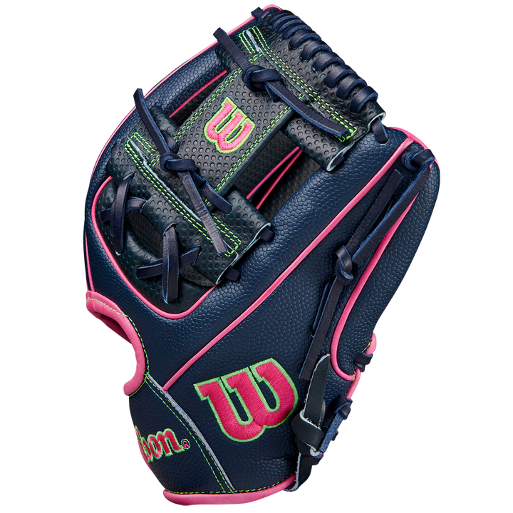 The Wilson A2000 DP15SS 11.5" Baseball Glove (SPRING 2025: WBW102747115) features navy blue leather, neon green accents, pink trim, and Pedroia Fit Technology for a snug fit, with green and pink Wilson logos on the thumb and wrist.