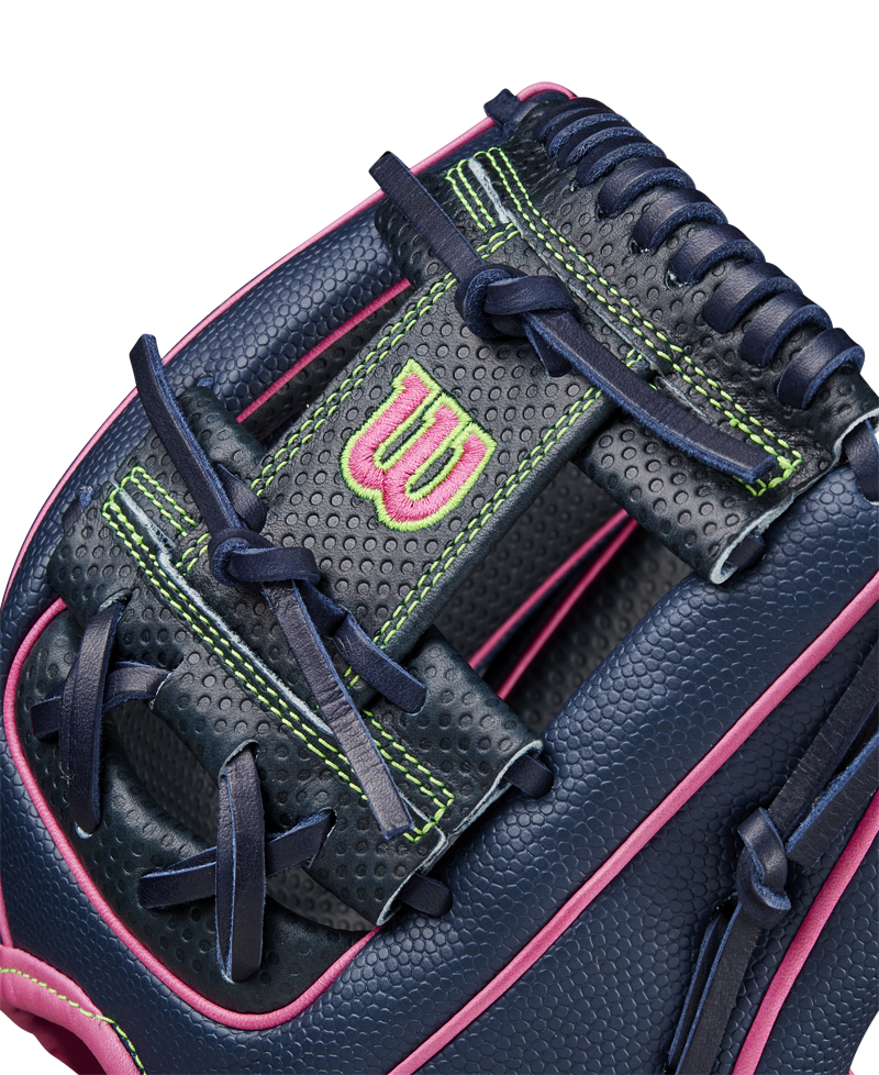 Close-up of the Wilson A2000 DP15SS 11.5" Baseball Glove (SPRING 2025), featuring navy blue leather, pink trim, neon green stitching, dark blue laces, Pedroia Fit Technology, a perforated texture, and a pink embroidered W logo.