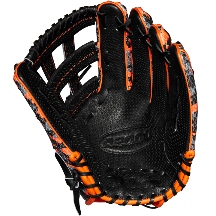 The Wilson A2000 SC1777SS 12.75" GOTM October 2024 baseball glove features a limited black design with orange accents, grey patterned details, embossed A5000 palm text, Pro Stock leather, and fine stitching. Model: WBW1027911275.