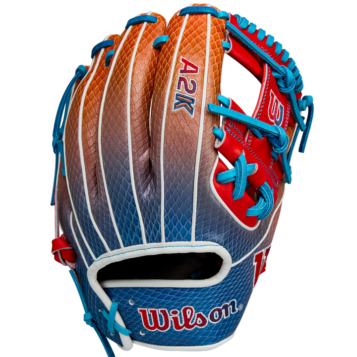 The Wilson A2K 1786SS 11.5" Baseball Glove (WBW103290115) features a gradient orange, brown, and blue design with blue laces, red accents, and durable SuperSnakeSkin construction. Summer 2025 release by Wilson.