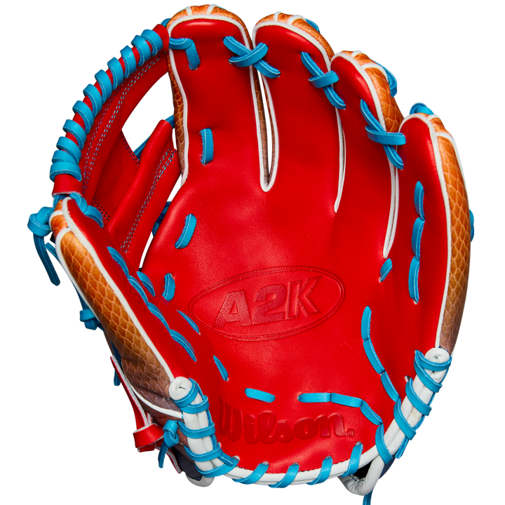 The Wilson A2K 1786SS 11.5" Baseball Glove (WBW103290115) features a red design with blue laces and SuperSnakeSkin for durability, crafted in the popular A2K 1786SS style—ideal for infielders.