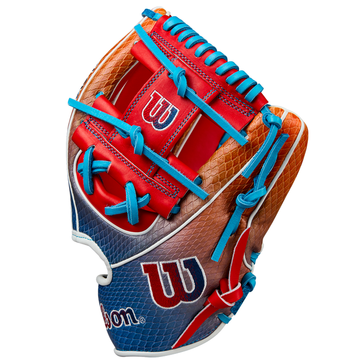 The Wilson A2K 1786SS 11.5" Baseball Glove (Summer 2025: WBW103290115) features a red, blue, orange, and brown design with blue laces, SuperSnakeSkin texture, and visible Wilson logos in red and white on the palm and wrist.