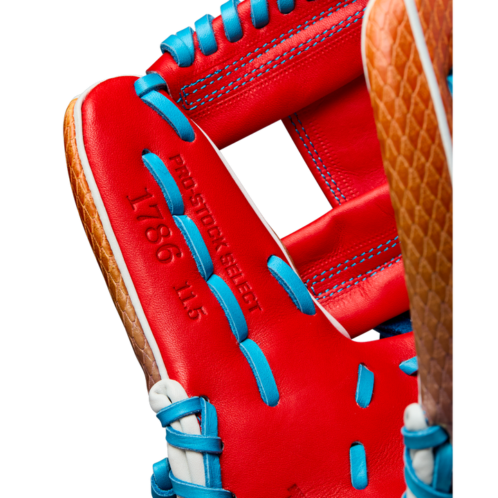Close-up of a Wilson A2K 1786SS 11.5" Baseball Glove (WBW103290115) with blue laces, brown accents, red SuperSnakeSkin leather, and PRO STOCK SELECT 1786 11.5 stamped on its surface.