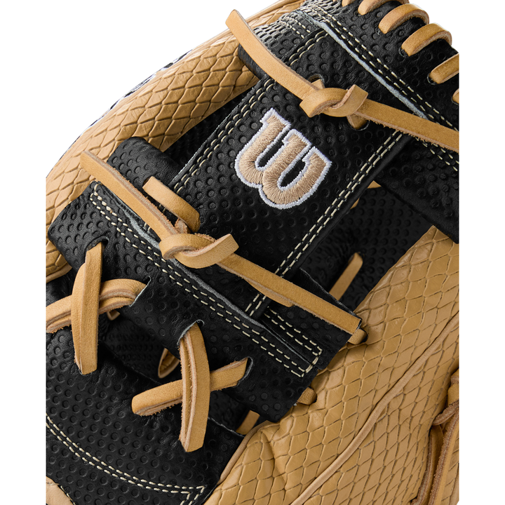 Close-up of the Wilson A2000 KBH13 11.75" Ke'Bryan Hayes GM Baseball Glove, featuring textured tan and black leather, tan laces, visible stitching, and an embroidered white W logo on a black panel. Summer 2025: WBW1032961175.