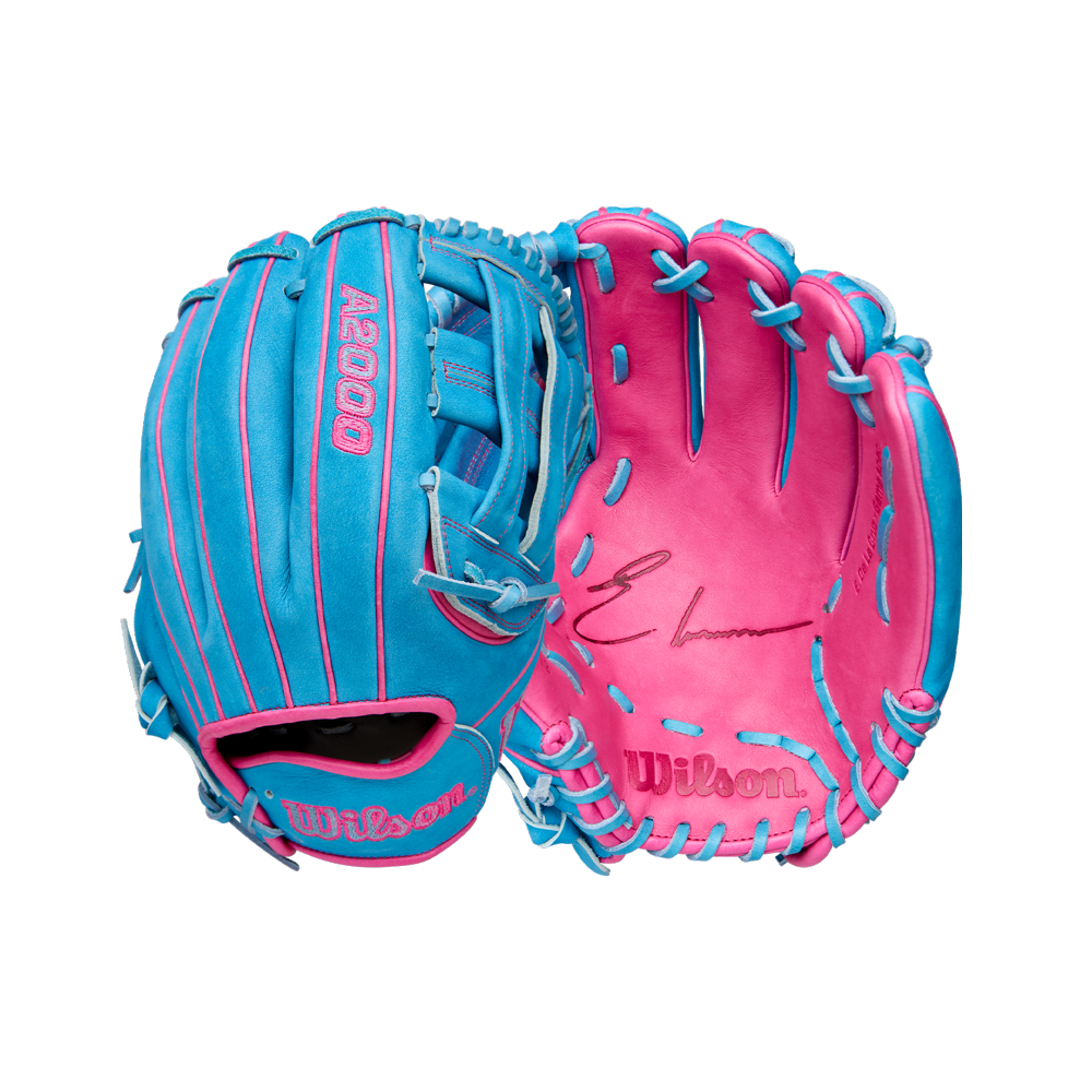 The Wilson A2000 EDLC44 12" Elly De La Cruz Gameday Glove (FALL 2025, WBW10345212) features a blue and pink design with light blue laces, Wilson logo and signature on the palm, and "A2000" stitched in pink on the back.