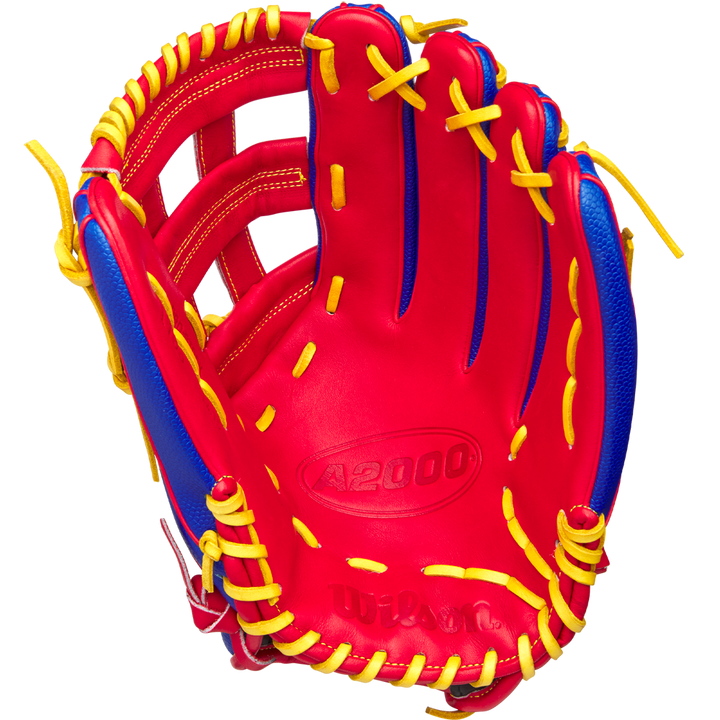 The Wilson A2000 1799SS 12.75" Pete Crow-Armstrong GM Baseball Glove (GOTM Jan 2025) features a red and blue design inspired by Pete Crow-Armstrong and the iconic A2000 1799SS style.
