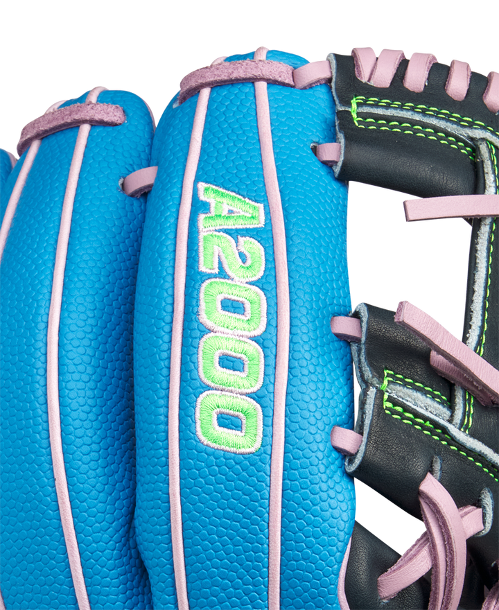 Close-up of the Wilson A2000 1786SS 11.5" Baseball Glove (GOTM March 2025) featuring blue Pro Stock leather, pink laces, green stitching, and "A2000" embroidered in green and white on the finger.