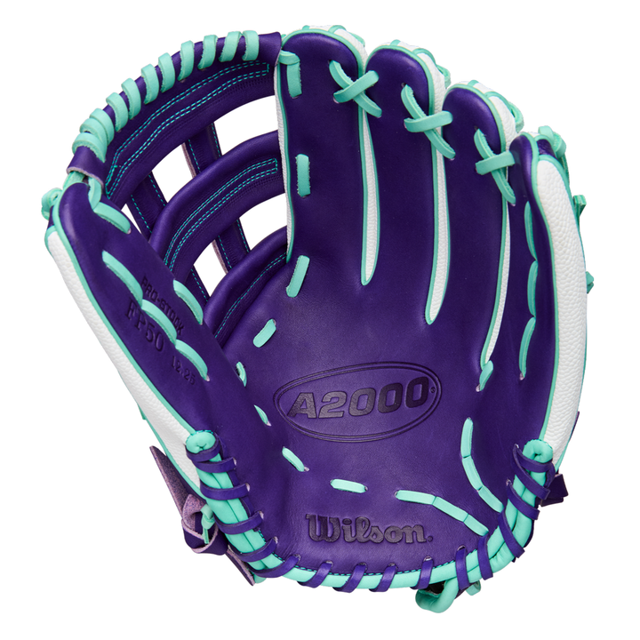 The Wilson A2000 FP50SS 12.25" Fastpitch Glove (FALL 2025: WBW1034891225) features a purple, teal, and white design with Pro Stock leather and SuperSkin, shown open to display the palm and inner stitching details.