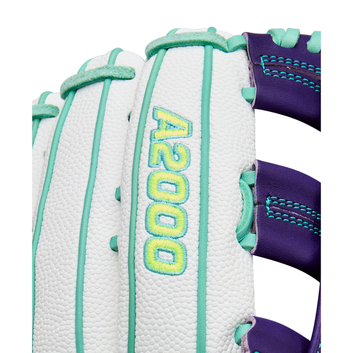 Close-up of the Wilson A2000 FP50SS 12.25" Fastpitch Glove, featuring white Pro Stock leather, teal stitching, yellow A2000 logo embroidery, and purple web accents.