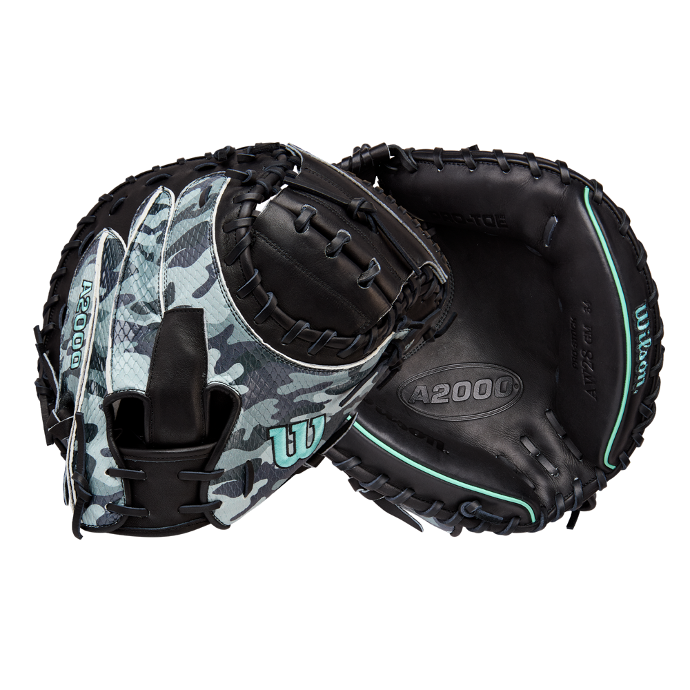 Two Wilson A2000 AW28 34" Austin Wells Gameday catcher's mitts (FALL 2025, WBW10349434) in black leather with blue camouflage, teal accents, and white stitching—one shows the palm; the other displays the back webbing and strap.