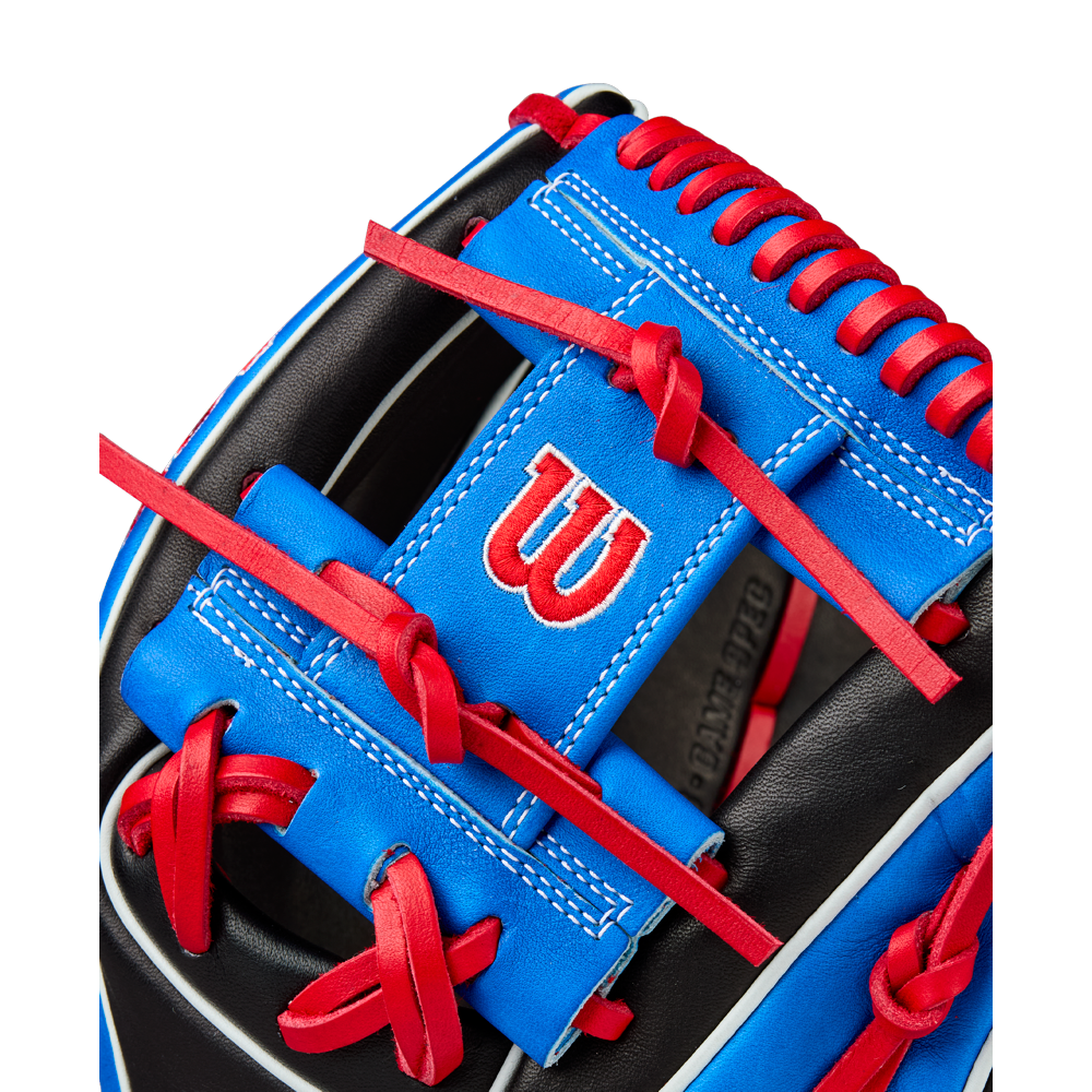Close-up of the Wilson A2K MB1175 11.75" Mookie Betts Gameday Baseball Glove, featuring blue and black Pro Stock Select leather, red laces, a white-stitched W logo on a blue patch, and modern Mookie Betts-inspired design.