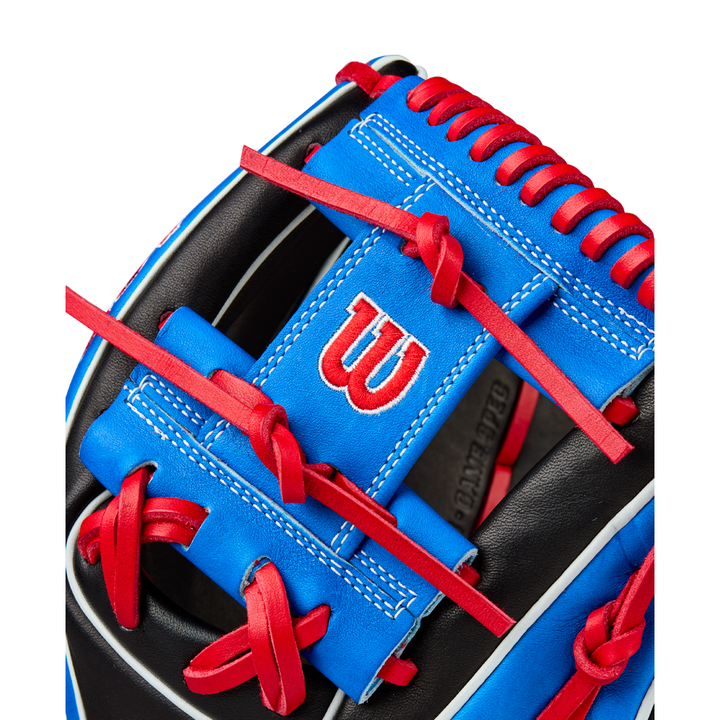 Close-up of the Wilson A2K MB1175 11.75" Mookie Betts Gameday Baseball Glove, featuring blue and black Pro Stock Select leather, red laces, a white-stitched W logo on a blue patch, and modern Mookie Betts-inspired design.
