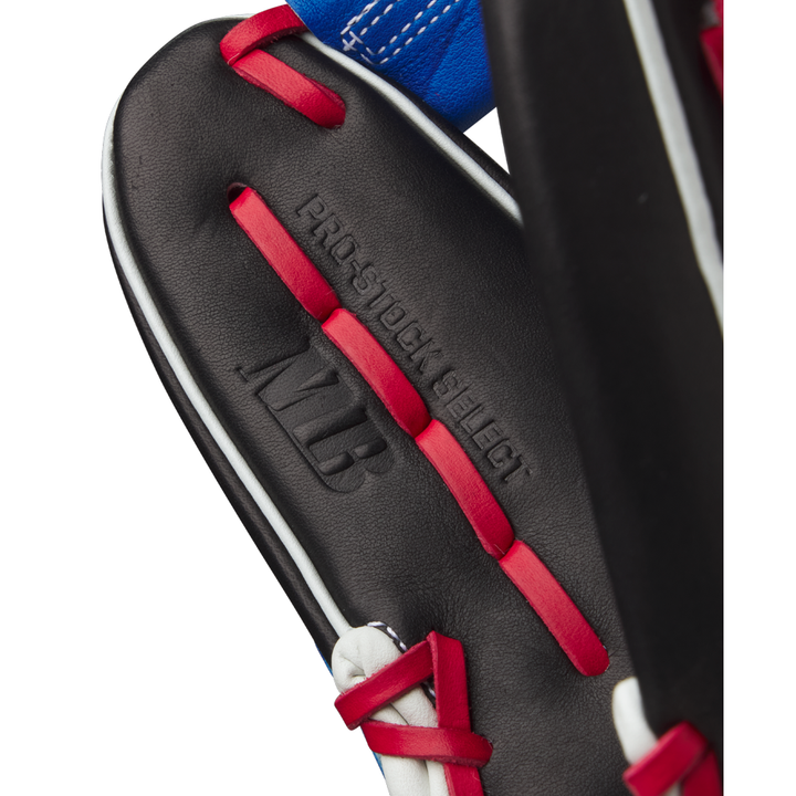 Close-up of a Wilson A2K MB1175 11.75" Mookie Betts Gameday Glove in black with red laces, white trim, and blue accents, featuring embossed PRO STOCK SELECT and MLB text on premium Pro Stock Select leather.