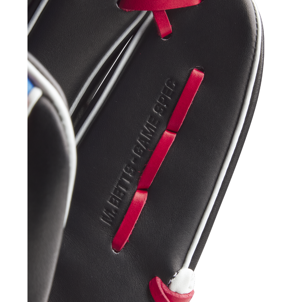 Close-up of the Wilson A2K MB1175 11.75" Mookie Betts Gameday Baseball Glove, showing black Pro Stock Select leather, red laces, white stitching, embossed “WE BETTER GAME 9FHC” text, and part of the glove’s edge.