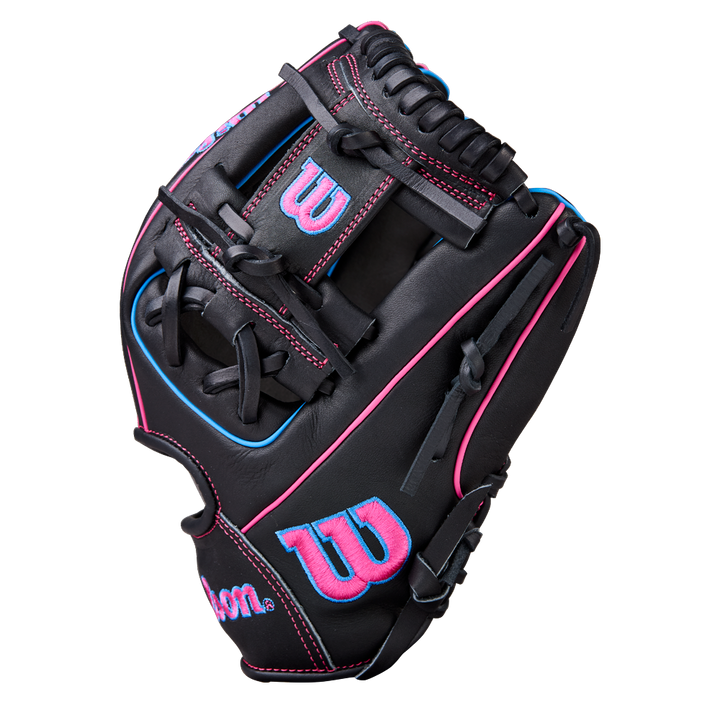 The Wilson A1000 DP15 11.5" Baseball Glove (WBW103956115) is a black full grain leather infield glove with pink and blue stitching, pink "W" logos on the thumb and back, shown on a plain white background.