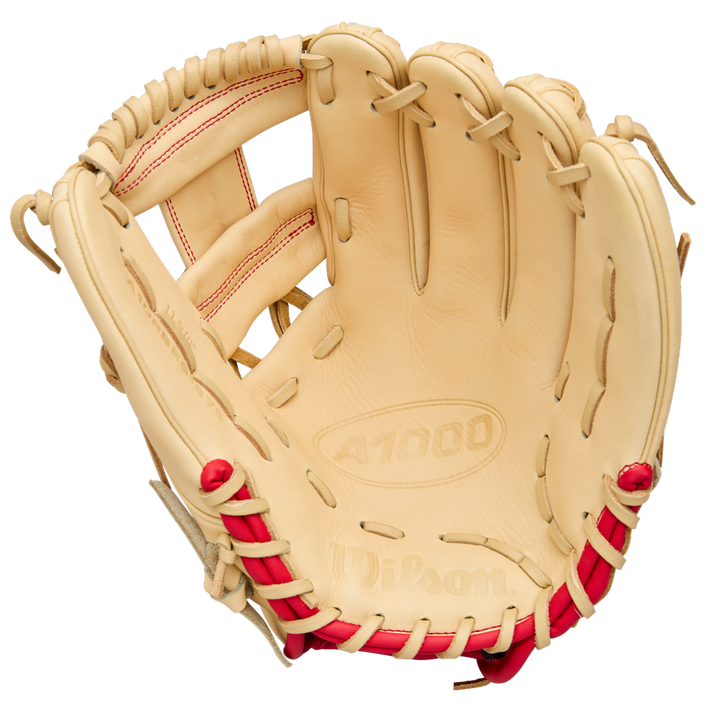 A tan Wilson A1000 1975 11.75" youth infield glove with red stitching and laces is shown open, displaying the pocket and finger slots. The palm is embossed with Wilson and A1000. Model: WBW1039591175.