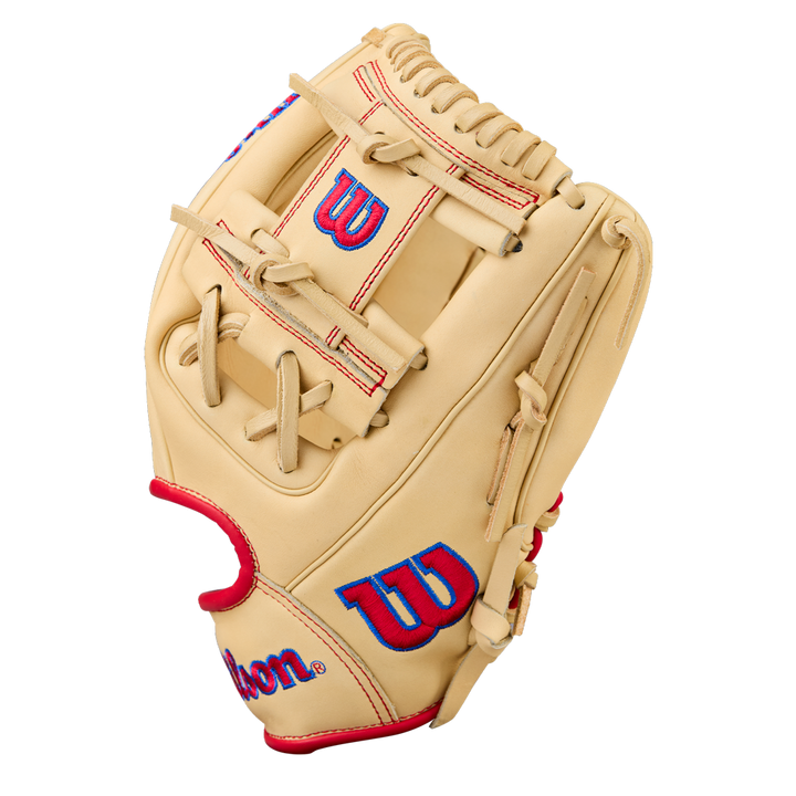 The Wilson A1000 1975 11.75" Baseball Glove (WBW1039591175) features a tan design with red laces and blue-and-red Wilson logos on the thumb and wrist, displayed against a plain white background.