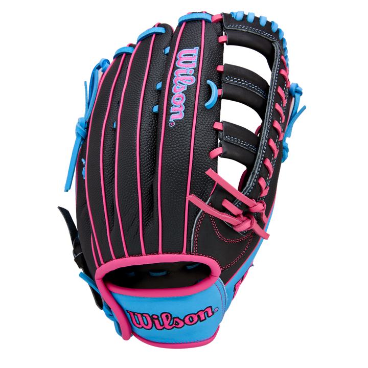 The Wilson A1000 1892 12.25" Baseball Glove by Wilson is a black outfield glove made from Full Grain leather, highlighted with pink and blue stitching, laces, and accents, including a blue and pink Wilson logo on the wrist.