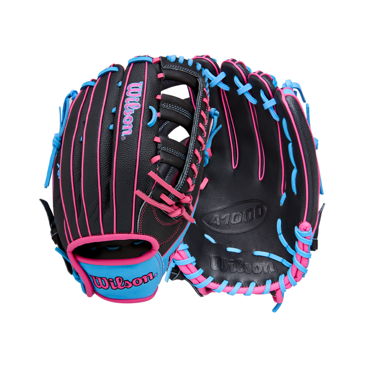 A Wilson A1000 1892 12.25" baseball glove (WBW1039621225) in black with bright blue and pink laces, made from Full Grain leather, is shown open and closed on a white background.