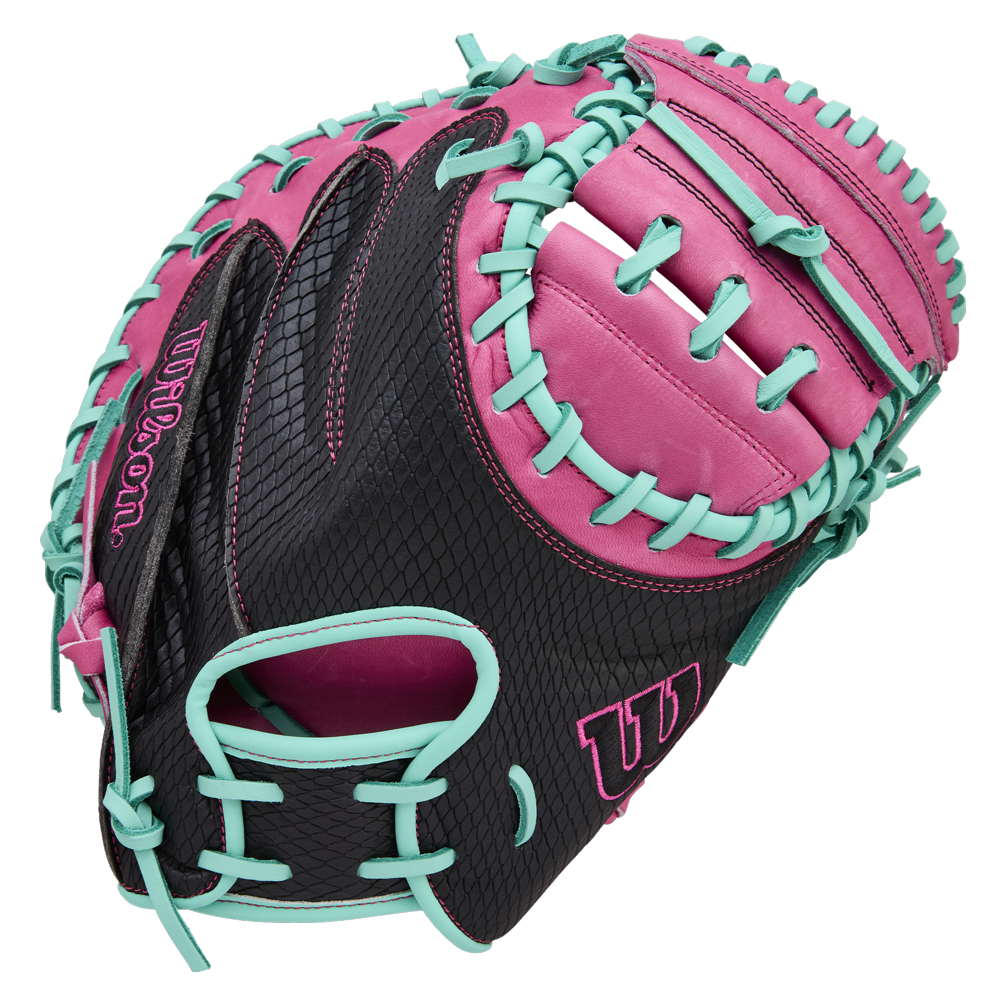 The Wilson A1000 CM33 33" Baseball Catcher's Mitt (WBW10396633) features full grain black leather with pink accents, bright turquoise lacing, and the Wilson logo on the thumb and pinky.