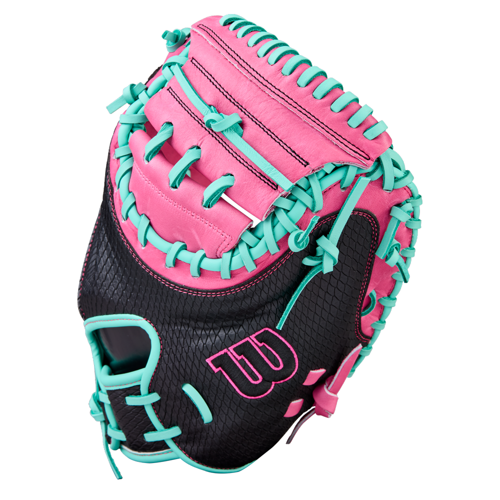 The Wilson A1000 CM33 33" Baseball Catcher's Mitt (WBW10396633) by Wilson features black full grain leather, pink accents, teal laces, and a large W logo—perfect as a stylish youth catcher’s mitt, shown against a white background.
