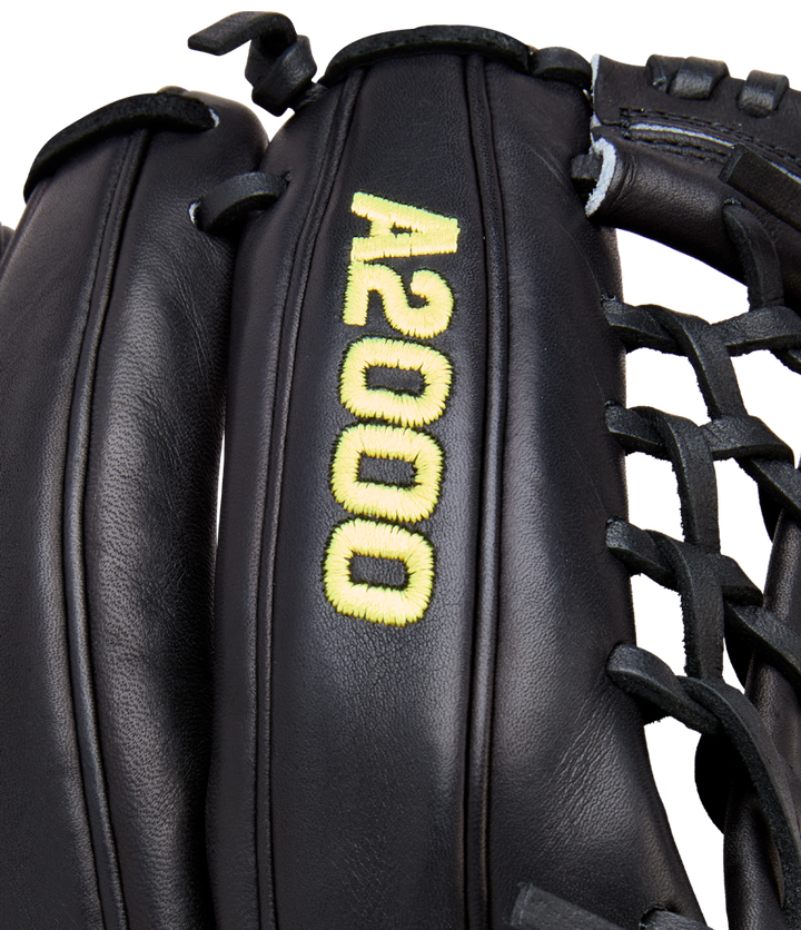 Close-up of the Wilson A2000 1789 11.5" Baseball Glove (WBW104106115), crafted with Pro Stock leather. This black Wilson glove features yellow "A2000" stitching, black laces, and detailed craftsmanship.