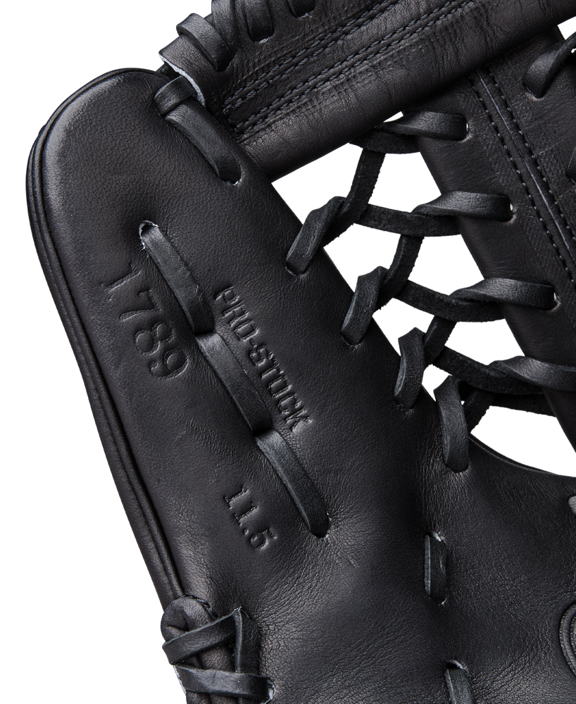 Close-up of a Wilson A2000 1789 11.5" Baseball Glove (WBW104106115), highlighting black premium Pro Stock leather, detailed stitching, and laces from the renowned Wilson brand.