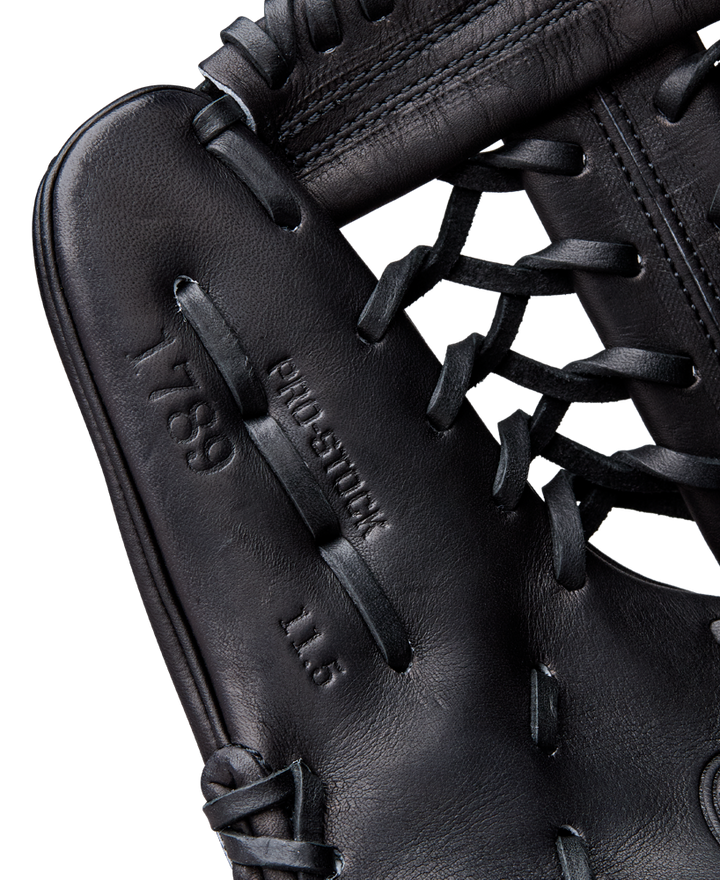 Close-up of a Wilson A2000 1789 11.5" Baseball Glove (WBW104106115), highlighting black premium Pro Stock leather, detailed stitching, and laces from the renowned Wilson brand.