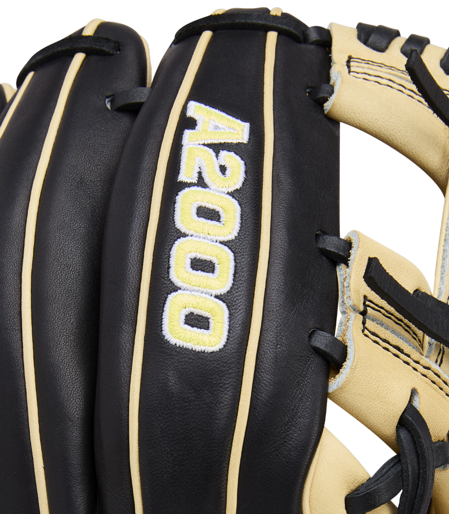Close-up of the Wilson A2000 1786 11.5" Baseball Glove (WBW104108115) in black and tan, featuring white and yellow A2000 embroidery, crafted from Pro Stock Leather with contrasting stitching and durable H-Web construction.