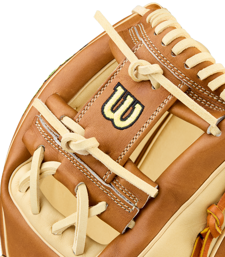 A close-up of the Wilson A2000 1975 11.75" Baseball Glove (WBW1041131175) highlights its tan and brown Pro Stock Leather, intricate stitching, laces, and the signature embroidered W logo.