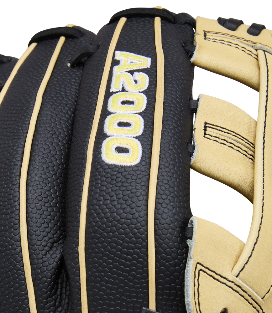Close-up of a Wilson A2000 DW5 12" infield baseball glove (model WBW10411612), crafted from Pro Stock Leather, in black and tan, with "A2000" stitched in white and yellow on the back.
