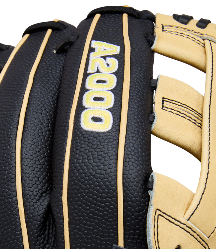 Close-up of a Wilson A2000 DW5 12" infield baseball glove (model WBW10411612), crafted from Pro Stock Leather, in black and tan, with "A2000" stitched in white and yellow on the back.